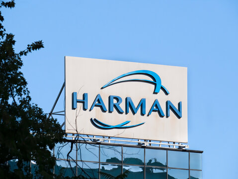 Bucharest, Romania - 10.01.2021: Harman International Industries logo against blue sky, in Bucharest