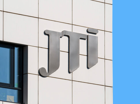Bucharest, Romania - 10.01.2021: JTI company logo on a building in Bucharest. JTI Romania is a subsidiary of JTI ( Japan Tobacco Inc)