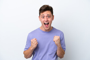 Young handsome Brazilian man isolated on white background celebrating a victory in winner position