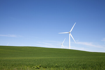 Fototapeta na wymiar Wind turbines with blue sky