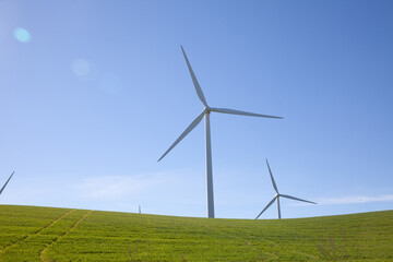 Fototapeta na wymiar Wind turbine with blue sky