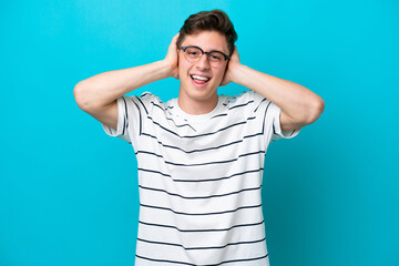 Young handsome Brazilian man isolated on blue background laughing