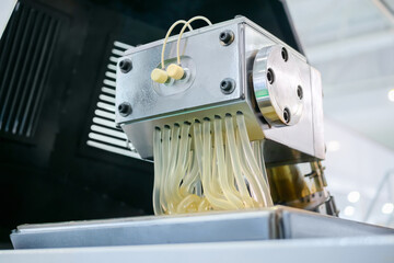 Waste plastic recycling machine: process of melting polyethylene at plant, factory - close up view....