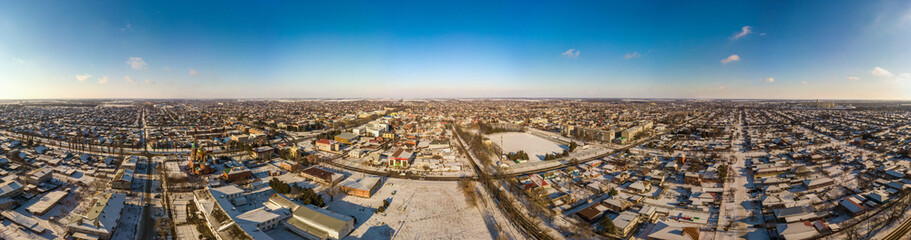 winter panoramic landscape of Korenovsk city (South of Russia) - snow-covered courtyards and low-rise buildings