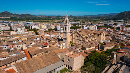 Fototapeta na wymiar Jativa ,Valencia, Spain, Europe. Aerial photo from drone to Spanish town of Xativa on background of Roman Catholic Basilica. (Series)
