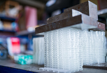 Stacks of glass containers under press for TFT displays