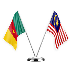 Two table flags isolated on white background 3d illustration, cameroon and malaysia