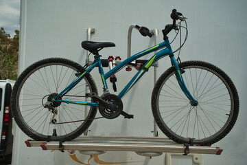 bike on a bike rack the back of a caravan