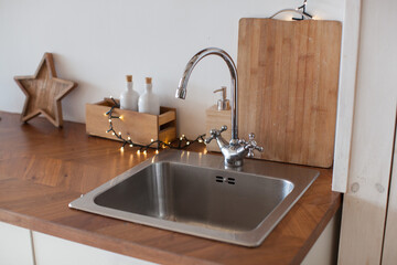 Kitchen sink. Scandinavian interior. White color. Stay at home. Christmas mood and decoration. 