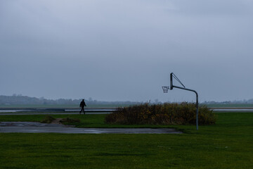empty basketball court in winter © Uri