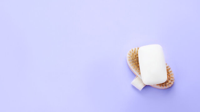 White soap bar on wooden brush. Body and beauty care concept stock image. Web banner