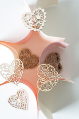 abstract background with wooden hearts and paper