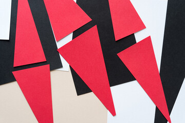 black, red, beige, and white paper background
