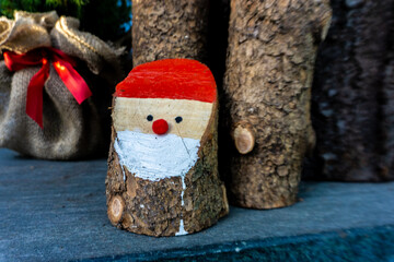 small homemade Santa Claus from tree trunk