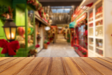Wooden board empty table in front of blurred background. Shop gallery blurred brown wood perspective