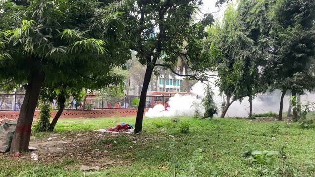 Worker Spaying With Larvicide Fog At Park Beside Road In Dhaka, Bangladesh