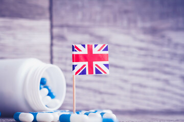 Medicines in the UK. Country flag and pills close up. Pharmacy products