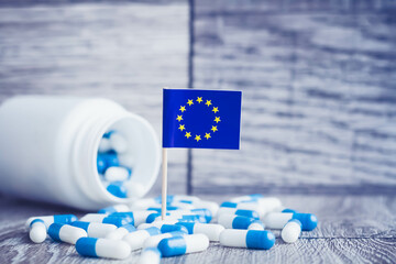 Medicines in the European Union. Country flag and pills close up. - obrazy, fototapety, plakaty