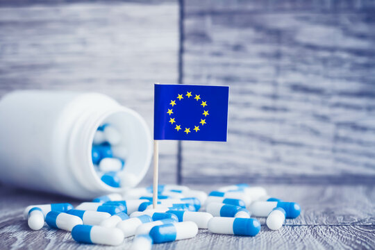 Medicines in the European Union. Country flag and pills close up.