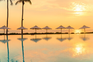 umbrella with bed pool around swimming pool with ocean sea background