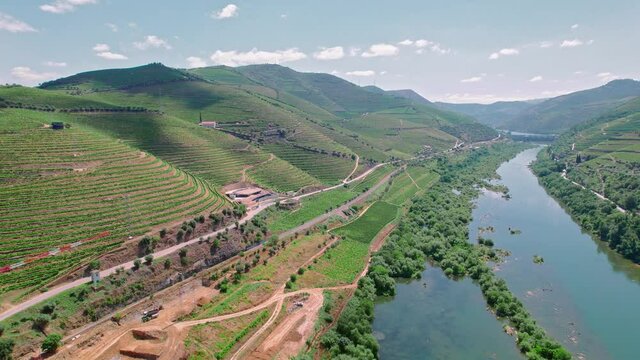 Scenic aerial view of Vila Real District along the Douro River with vineyards. Portuguese massive hills of landscapes wine growing by the National 222 Road, a traditional occupation in Portugal in 4K.
