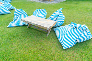bean bag with table on grass in the garden