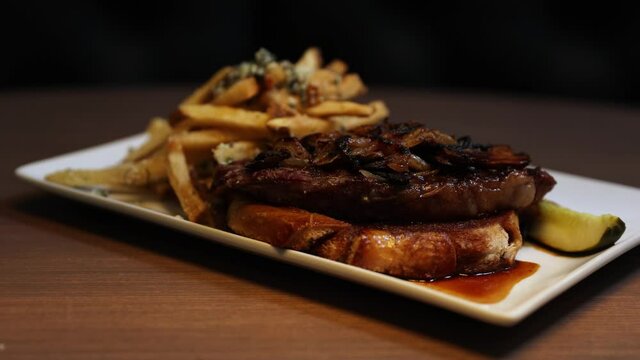Sirloin Steak With Chips, Mash Potato And Gravy - Rotating Close Up