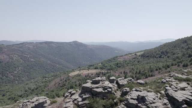 video with drone flying parc national des cevennes france with a single person on the horizon