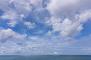 Naklejka na ściany i meble Summer sea background Blue sky white clouds over sea in Phuket Thailand