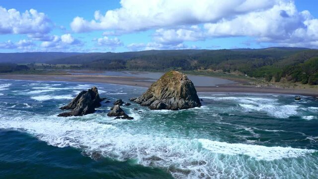 piedra del viento topocalma beach, stone of the wind litueche puertecillo matanzas windsurfing spot surfing spot. CHile drone shot orbital and view lagoon
