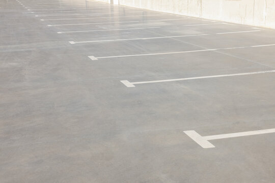 Outdoor car parking lot with white marking lines