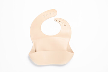 Light pink silicone baby bib isolated on white, top view