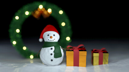 3D Scene Snowman wear red hat green scarf and gift box on white snow near blurred Christmas wreath and glowing light on dark in winter season on the cold day  in December Christmas happy new year