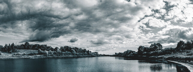 Dark stormy clouds over the lake