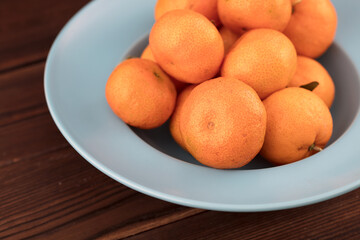 Fresh oranges on the plate