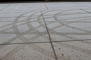 tire tracks in snow on pavement