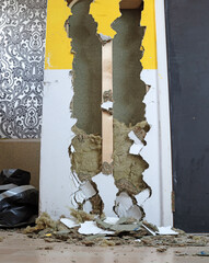 Breaking a wooden wall, remodeling a house