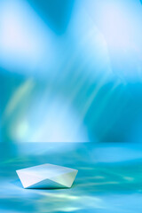 Abstract surreal scene - empty stage with polygonal podium lying on pastel blue neon holographic...