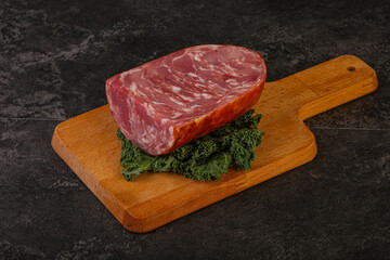 Beef ham piece over board