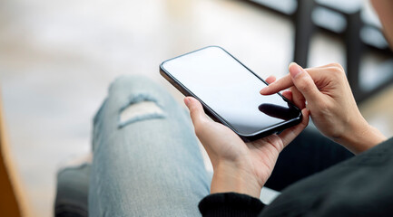 Closeup young woman using smartphone. Woman hand touch screen smartphone in hand, online message.