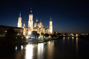 Fototapeta na wymiar Basilica Del Pilar in Zaragoza in night illumination, Spain