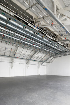Metal ceiling inside of empty industial hall