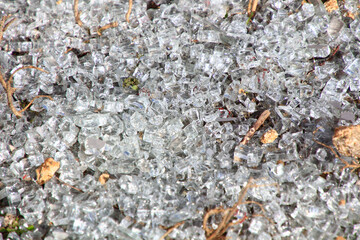 background with small pieces of broken glass covering the ground