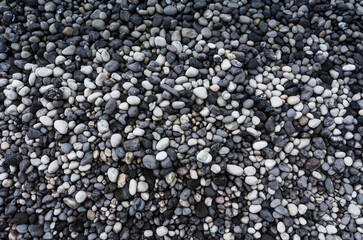 Gray and white pebbles heap at beach