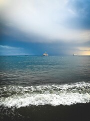wonderful idyllic sunset at the sea, sea horizon with ships