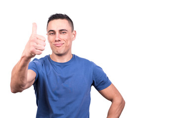 Naklejka premium Smiling man gesturing to be okay with the thumb