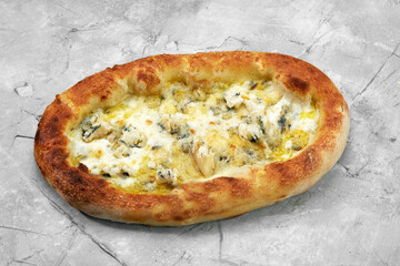 Closeup view of four cheese pizza isolated over white.
