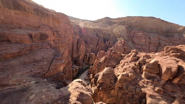 Fpv drone sequence through rocks in a canyon in Jordan