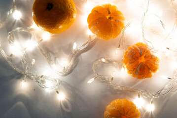 tangerines and garlands on a white background