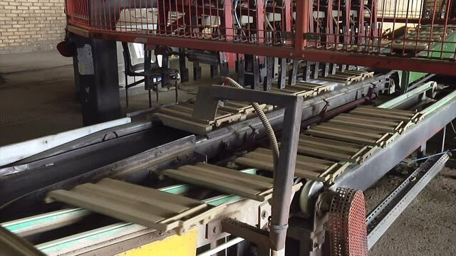 Roof Tile Production Line ; Production line of a modern factory for making ceramic tiles